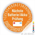 Prüfetiketten, Prüfplakette rund, Farbe- Orange, Text "Nächste Batterie/Akku Prüfung" in Weiß. Icon Batterie, Startjahr- 25, Monatszahlen Oben und Jahreszahlen Unten in Kreisform.