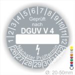 Prüfplakette rund mit Text geprüft nach DGUV Vorschrift 4 danach Beschriftungsfeld in Weiß und Text Nächster Prüftermin. Plaketten Farbe- Grau und Text in Weiß. Monatszahlen oben und Jahreszahlen unten beginnend mit Startjahr- 26.