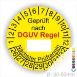 Prüfplakette rund mit Text geprüft nach DGUV Regel danach Beschriftungsfeld in Weiß und Text Nächster Prüftermin. Plaketten Farbe- Gelb und Text in Schwarz. Monatszahlen oben und Jahreszahlen unten beginnend mit Startjahr- 26. Durchmesser 20-50mm frei wählbar.