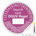 Prüfplakette rund mit Text geprüft nach DGUV Regel danach Beschriftungsfeld in Weiß und Text Nächster Prüftermin. Plaketten Farbe- Lila und Text in Weiß. Monatszahlen oben und Jahreszahlen unten beginnend mit Startjahr- 26. Durchmesser 20-50mm frei wählbar.