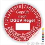 Prüfplakette rund mit Text geprüft nach DGUV Regel danach Beschriftungsfeld in Weiß und Text Nächster Prüftermin. Plaketten Farbe- Rot und Text in Weiß. Monatszahlen oben und Jahreszahlen unten beginnend mit Startjahr- 26. Durchmesser 20-50mm frei wählbar.