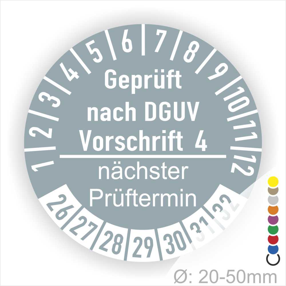 Prüfplakette mit Text Geprüft nach Dguv Vorschrift 4 und Nächster Prüftermin mit zwischen Strich in Weiss. Plaketten Farbe- Grau und Text in Weiss. Monatszahlen oben und Jahreszahlen unten beginnend mit Startjahr- 26