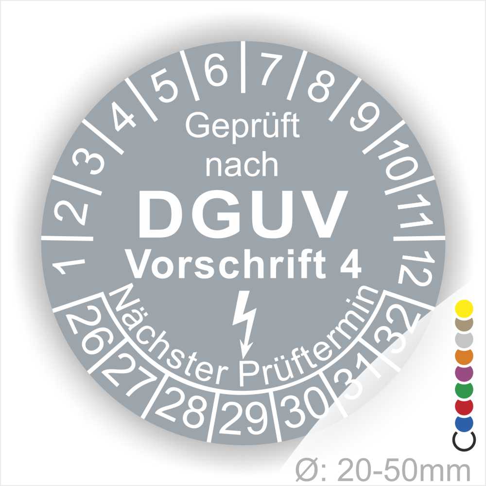 Prüfplakette rund mit Text geprüft nach Dguv Vorschrift 3 danach Elektropfeilund Text Nächster Prüftermin. Plaketten Farbe- Grau und Text in Weiß. Monatszahlen oben und Jahreszahlen unten beginnend mit Startjahr- 26.