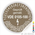 Prüfplaketten rund, Text "geprüft gemäß VDE 0105-100" Farbe- Braun Startjahr- 26 mit Elektro Pfeil, Monatszahlen Oben und Jahreszahlen Unten