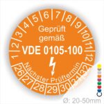 Prüfplaketten rund, Text "geprüft gemäß VDE 0105-100" Farbe- Orange Startjahr- 26 mit Elektro Pfeil, Monatszahlen Oben und Jahreszahlen Unten