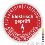 Prüfplaketten rund Farbe- Rot, Text "Elektrisch geprüft" in Weiß Startjahr- 26 mit Elektro Pfeil, Monatszahlen Oben und Jahreszahlen Unten in Kreisform