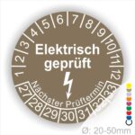 Prüfplaketten rund Farbe- Braun, Text "Elektrisch geprüft" in Weiß danach ein Elektro- Pfeil in Weiß, Startjahr- 27, Monatszahlen Oben und Jahreszahlen Unten in Kreisform