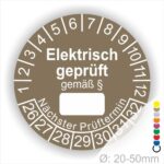 Pruefplakette mit Text Elektrisch geprüft gemäß Paragrapf als Zeichen und Beschriftungfeld zum eintragen des Paragraphs Farbe- Braun Startjahr- 26 mit Monatszahlen Oben und Jahreszahlen Unten Form ist Rund