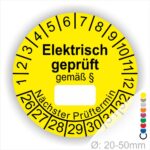 Pruefplakette mit Text Elektrisch geprüft gemäß Paragrapf als Zeichen und Beschriftungfeld zum eintragen des Paragraphs Farbe- Gelb Startjahr- 26 mit Monatszahlen Oben und Jahreszahlen Unten Form ist Rund
