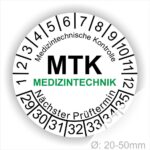Prüfplakette MTK Medizintechnik rund, Farbe- Weiß, Text "Medizintechnische Kontrolle, MTK MEDIZINTECHNIK Nächster Prüftermin" in Schwarz. Startjahr- 29, Monatszahlen Oben und Jahreszahlen Unten in Kreisform. über den Jahreszahlen Text.