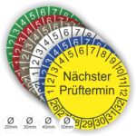 Prüfplaketten mit Text Nächster Prüftermin Startjahr- 26, Monatszahlen Oben und Jahreszahlen Unten in Kreisform.