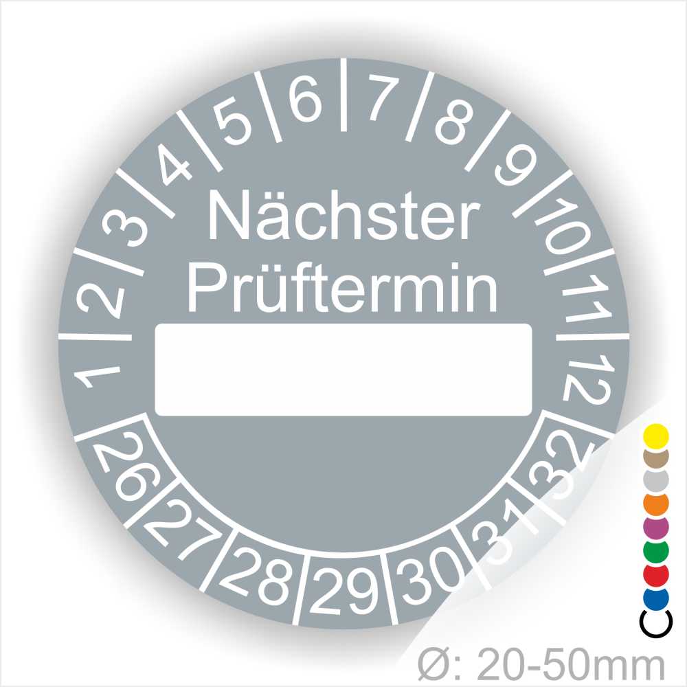 Prüfplakette, Prüfetikett rund, Farbe- Grau, Text "Nächster Prüftermin" in Weiß. Als nächstes kommt ein Beschriftungfeld / Leerfeld in Farbe Weiß. Startjahr- 26, Monatszahlen Oben und Jahreszahlen Unten in Kreisform.