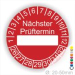 Prüfplakette, Prüfetikett rund, Farbe- Rot, Text "Nächster Prüftermin" in Weiß. Als nächstes kommt ein Beschriftungfeld / Leerfeld in Farbe Weiß. Startjahr- 26, Monatszahlen Oben und Jahreszahlen Unten in Kreisform.