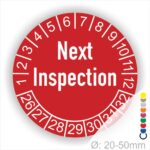 Prüfetiketten, Prüfaukleber rund, Farbe- Rot, Text auf Englisch "Next Inspection" in Weiß. Startjahr- 26, Monatszahlen Oben und Jahreszahlen Unten in Kreisform.