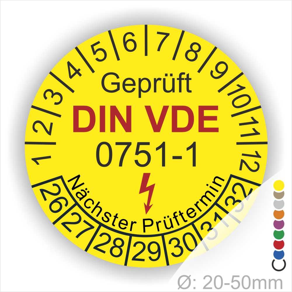 Prüfplaketten rund, Farbe- Gelb, Text "Geprüft gemäß DIN VDE 0751-1" in Schwarz danach ein Elektro- Pfeil in Rot, Startjahr- 26, Monatszahlen Oben und Jahreszahlen Unten in Kreisform. Über den Jahreszahlen Text "Nächster Prüftermin"