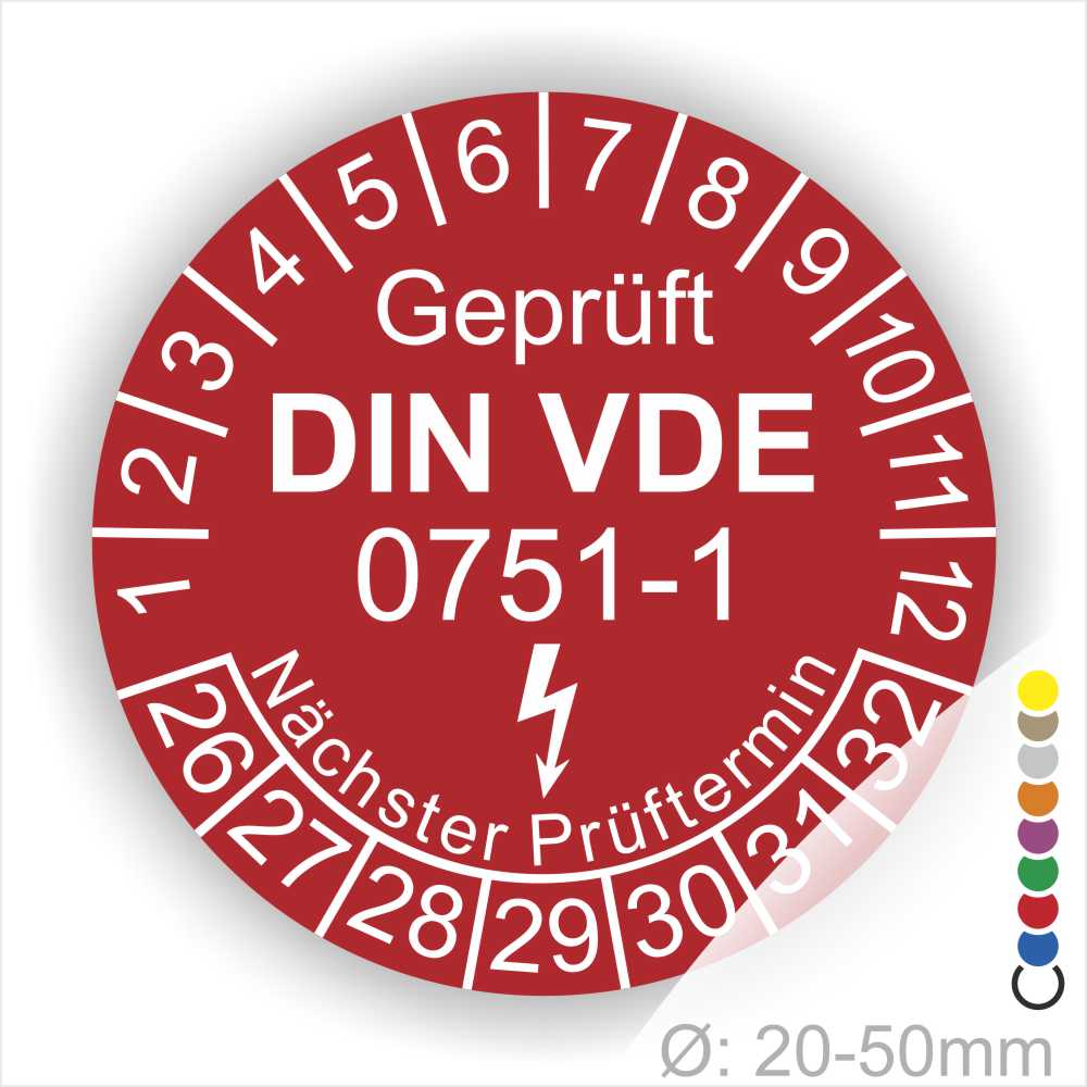 Prüfplaketten rund, Farbe- Rot, Text "Geprüft gemäß DIN VDE 0751-1" in Weiß danach ein Elektro- Pfeil in Weiß, Startjahr- 26, Monatszahlen Oben und Jahreszahlen Unten in Kreisform. Über den Jahreszahlen Text "Nächster Prüftermin"