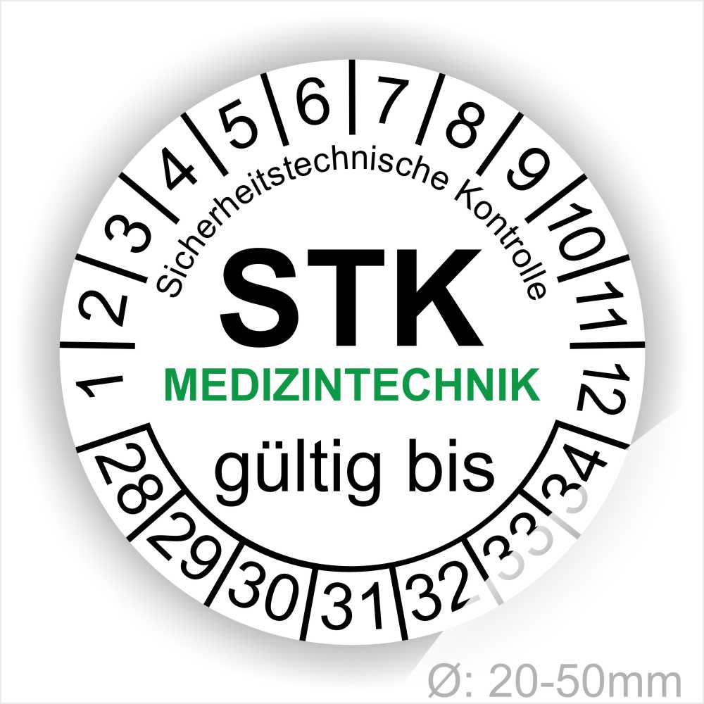 Prüfetiketten rund, Farbe- Weiß, Text "Sicherheitstechnische Kontrolle, STK MEDIZINTECHNIK gültig bis" in Schwarz. Startjahr- 28, Monatszahlen Oben und Jahreszahlen Unten in Kreisform. über den Jahreszahlen Text.