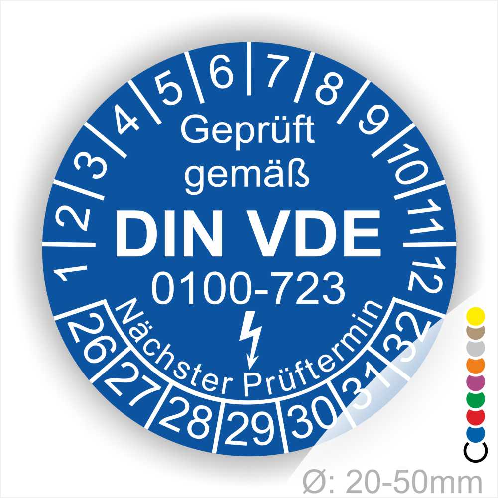 Prüfetiketten rund, Farbe- Blau, Text "Geprüft gemäß VDE 0100-0723" in Weiß danach ein Elektro- Pfeil in Weiß, Startjahr- 26, Monatszahlen Oben und Jahreszahlen Unten in Kreisform. Über den Jahreszahlen Text "Nächster Prüftermin"