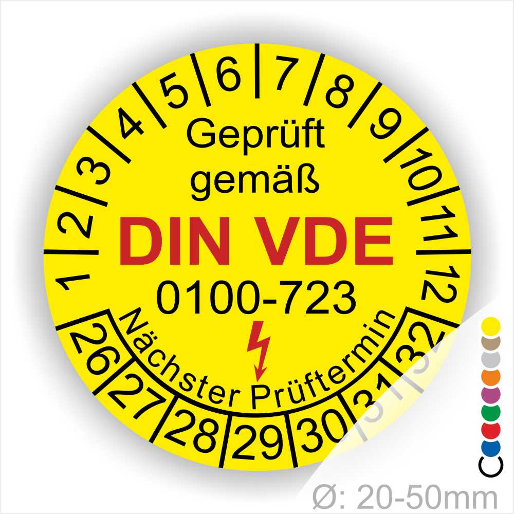 Prüfplakette, Prüfetikette rund, Farbe- Gelb, Text "Geprüft gemäß VDE 0100-723" in Schwarz danach ein Elektro- Pfeil in Rot, Startjahr- 26, Monatszahlen Oben und Jahreszahlen Unten in Kreisform. Über den Jahreszahlen Text "Nächster Prüftermin"