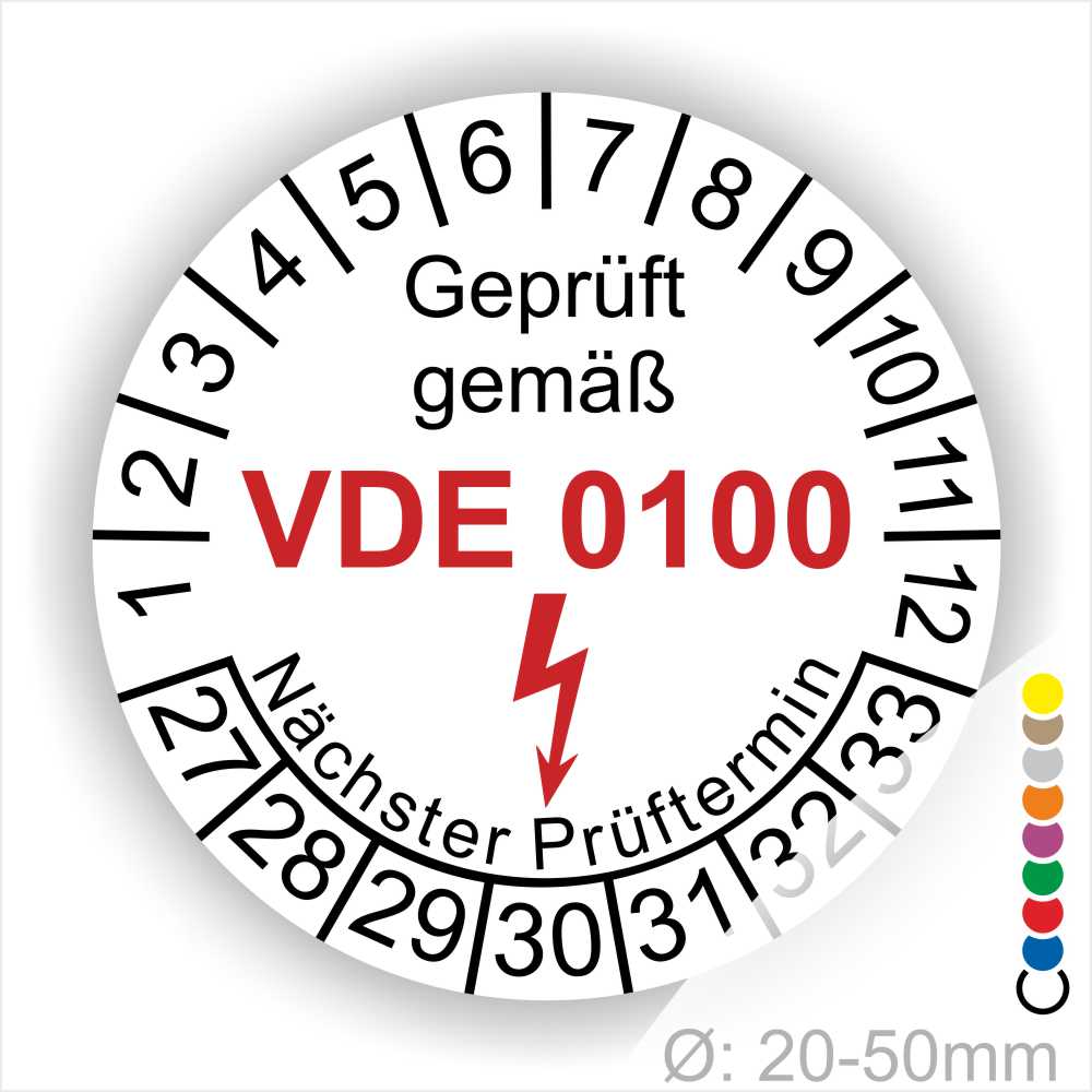 Prüfaufkleber rund, Farbe- Weiß, Text "Geprüft gemäß VDE 0100" in Schwarz danach ein Elektro- Pfeil in Rot, Startjahr- 28, Monatszahlen Oben und Jahreszahlen Unten in Kreisform. Über den Jahreszahlen Text "Nächster Prüftermin"