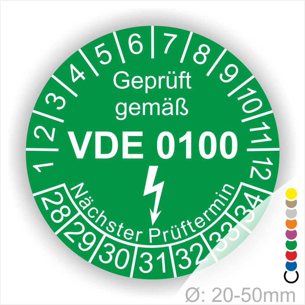 Prüfetikette rund, Farbe- Grün, Text "Geprüft gemäß VDE 0100" in Weiß danach ein Elektro- Pfeil in Weiß, Startjahr- 28, Monatszahlen Oben und Jahreszahlen Unten in Kreisform. Über den Jahreszahlen Text "Nächster Prüftermin"