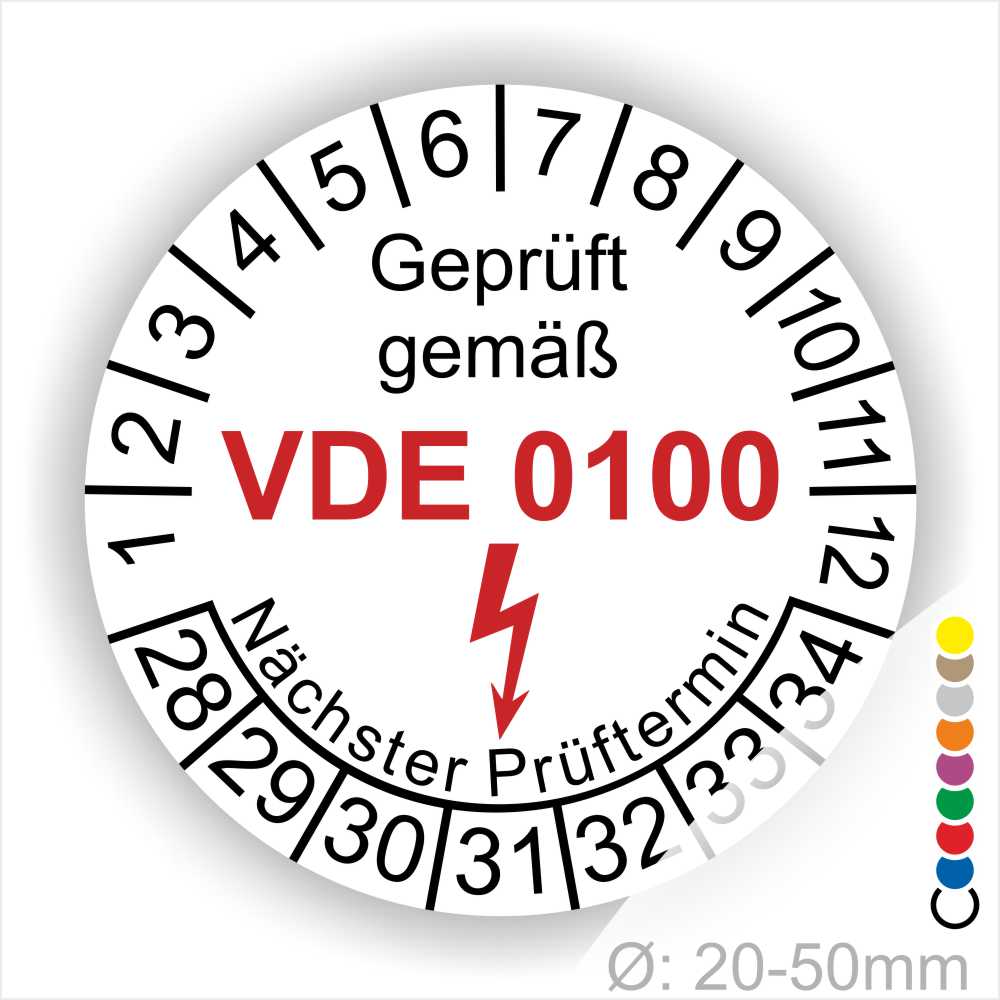 Prüfaufkleber rund, Farbe- Weiß, Text "Geprüft gemäß VDE 0100" in Schwarz danach ein Elektro- Pfeil in Rot, Startjahr- 28, Monatszahlen Oben und Jahreszahlen Unten in Kreisform. Über den Jahreszahlen Text "Nächster Prüftermin"