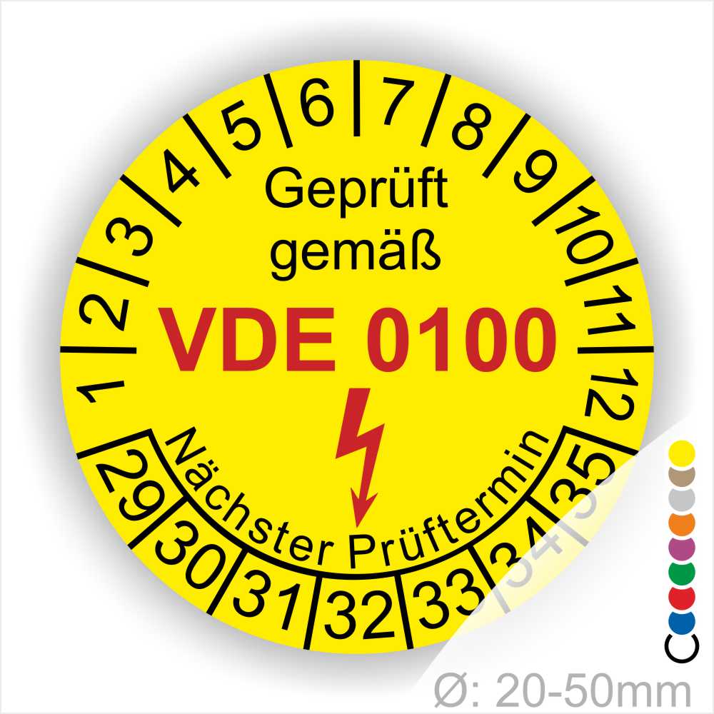 Prüfaufkleber, Prüfsiegel rund, Farbe- Gelb, Text "Geprüft gemäß VDE 0100" in Schwarz danach ein Elektro- Pfeil in Rot, Startjahr- 29, Monatszahlen Oben und Jahreszahlen Unten in Kreisform. Über den Jahreszahlen Text "Nächster Prüftermin"