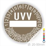 Prüfplaketten, rund, Farbe- Braun, Text "UVV Nächster Prüftermin" in Weiß. Als nächstes kommt ein Beschriftungfeld / Leerfeld in Farbe Weiß. Startjahr- 26, Monatszahlen Oben und Jahreszahlen Unten in Kreisform. über den Jahreszahlen Text "Nächster Prüftermin" Die Prüfplakette wird verwendet zur Prüfung von Anlagen & Maschine