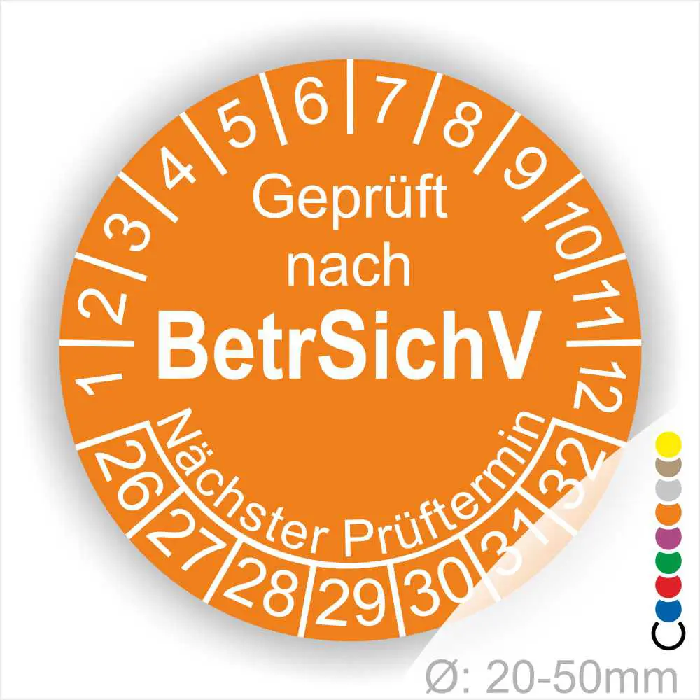 Orangefarbige Prüfplakette mit dem Text "Geprüft nach BetrSichV" und Angaben zum nächsten Prüftermin. Die Plakette ist für Geräte mit einem Durchmesser von 20-50 mm vorgesehen und zeigt die Prüfnummern von 1 bis 32.