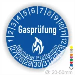 Blaues Prüfzeichen für Gasprüfungen mit den Monaten und den nächsten Prüfungsterminen, Durchmesser 20-50 mm.
