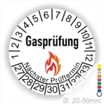 Gasprüfungsplakette mit nächstem Prüftermin und Feuer-Symbol, Durchmesser 20-50 mm, zur Kennzeichnung von Sicherheitsprüfungen für Gasgeräte.