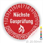 Runder Aufkleber für die nächste Gasprüfung mit rotem Hintergrund, weißen Zahlen von 1 bis 32 und einem Flammensymbol. Ideal zur Kennzeichnung von Prüfterminen in gewerblichen und privaten Einrichtungen, Durchmesser 20-50 mm.