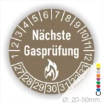 Runder Aufkleber in Braun der nächsten Gasprüfung mit Feuer-Icon und Zahlen von 1 bis 12 Monatszahlen und 27-33 Jahreszahlen. Ideal für die Sicherheit von Gasinstallationen. Durchmesser 20-50 mm.