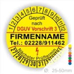 Gelbes Prüfsiegel mit der Aufschrift "Geprüft nach DGUV Vorschrift 3", Firmennamen und Kontaktdaten. Das Siegel zeigt den nächsten Prüftermin und hat einen Durchmesser von 25-50 mm.