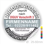 Prüfzertifikat gemäß DGUV Vorschrift 3 mit Firmendaten, Telefonnummer und nächstem Prüftermin. Das Bild zeigt einen Prüfaufkleber mit Durchmesser von 25-50 mm.