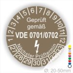 Prüfsiegel gemäß VDE 0701/0702 mit Angaben zu Prüfterminen und Prüfzahlen, Durchmesser von 20-50 mm.