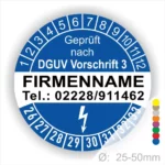 Alt-Text: Prüfplakette mit dem Hinweis "Geprüft nach DGUV Vorschrift 3", Platz für Firmennamen und Telefonnummer, mit farbigen Markierungen zur Kennzeichnung, Durchmesser von 25-50mm.