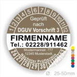 Alt-Text: Prüfplakette gemäß DGUV Vorschrift 3 mit Firmennamen, Telefonnummer, Adresse und nächstem Prüftermin, Durchmesser 25-50 mm.