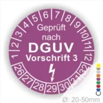 Alt-Text: Prüfplakette für elektrische Geräte, geprüft nach DGUV Vorschrift 3, mit einer Skala von 1 bis 12 und einem Durchmesser von 20-50 mm.