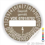 Prüfaufkleber gemäß VDE 0701/0702 zur Kennzeichnung von elektrischen Geräten, mit Platz für das nächste Prüfdatum und einem Durchmesser von 20-50 mm.