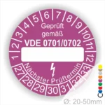Prüfsiegel für elektrische Geräte gemäß VDE 0701/0702, lila Hintergrund mit Platz für Prüfdatum, zeigt nächsten Prüftermin an, Durchmesser von 20-50 mm.