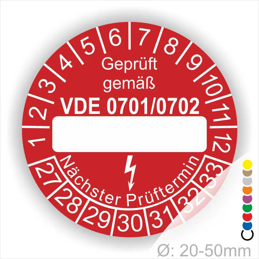 Rotes Prüfzeichen mit der Aufschrift „Geprüft gemäß VDE 0701/0702“. Das Label zeigt Platz für das Prüfdatum und den nächsten Prüftermin. Durchmesser zwischen 20-50 mm, geeignet für elektrische Geräte.