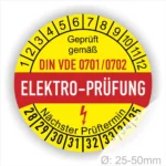 Rundes Prüfzeichen für Elektrogeräte gemäß DIN VDE 0701/0702, mit Angaben zur nächsten Prüfperiode und einem Durchmesser von 25-50 mm.