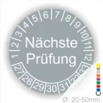 Prüfplaketten, Prüfetiketten rund, Farbe- grau, Text "Nächste Prüfung" in weiß. Startjahr- 27, Monatszahlen Oben und Jahreszahlen Unten in Kreisform.