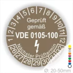 VDE Prüfplakette für elektrische Geräte, zeigt den nächsten Prüftermin und die Norm VDE 0105-100. Durchmesser: 20-50 mm.