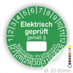 Grünes Prüflabel für elektrische Geräte mit der Aufschrift "Elektrisch geprüft gemäß §", das Platz für das nächste Prüfdatum bietet. Ideal zur Kennzeichnung von Geräten im gewerblichen und privaten Bereich. Durchmesser von 20-50 mm.