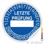 Blauer Prüfaufkleber mit der Aufschrift "LETZTE PRÜFUNG" und Platz für das Datum. Der Aufkleber zeigt Zahlen von 1 bis 12 und von 26 bis 32. Durchmesser von 20-50 mm, geeignet für regelmäßige Sicherheitsüberprüfungen.