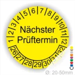 Mehrjahresplakette Prüfplakette rund, Farbe- Gelb, Text "Nächster Prüftermin" in Schwarz. Startjahr- 26, Monatszahlen Oben und Jahreszahlen Unten in Kreisform.