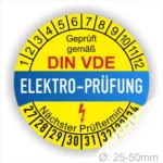Prüfsiegel für Elektrogeräte gemäß DIN VDE, gelb-blau, mit Angaben zum nächsten Prüftermin und einem Durchmesser von 25-50 mm.