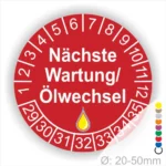 Prüfetiketten, Serviceplakette rund, Farbe- Rot, Text "Nächste Wartung/Ölwechsel" in Weiß. Startjahr- 29, Monatszahlen Oben und Jahreszahlen Unten in Kreisform, über den Jahreszahlen ein Öltropfen als Icon/Piktogramm in Gelb.